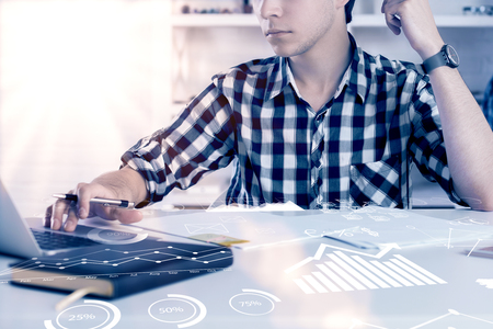 Hands using laptop with digital business interface. Technology and blockchain concept. Double exposure の写真素材