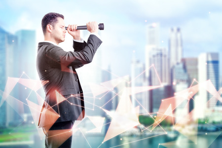 look into the future concept with businessman looking through a telescope at abstract day city backgroundの写真素材