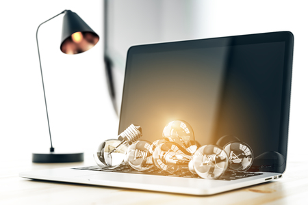 Close up of laptop with abstract glowing lamps. Technology, idea and solution concept. 3D Renderingの写真素材