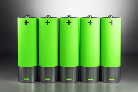 Creative green battery on gray background. Energy concept. 3D Renderingの写真素材