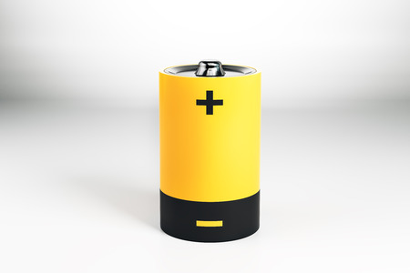 Creative yellow battery on gray background. Energy concept. 3D Rendering