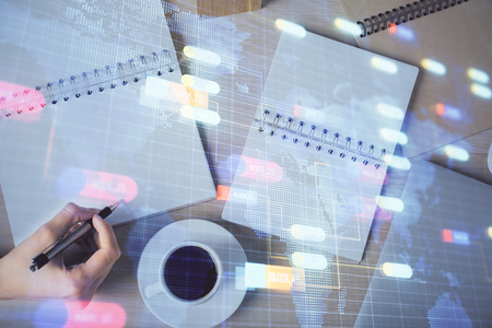 Multi exposure of womans writing hand on background with data technology hud. Concept of innovation.の写真素材