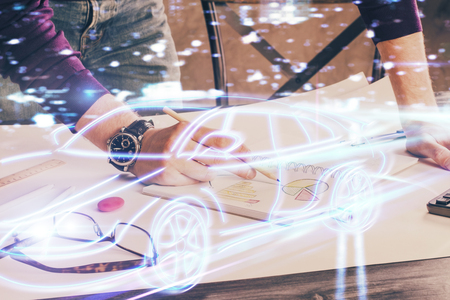 Close up of human hands background and autonomous self drive pilot vehicle concept. Multi exposure.の写真素材