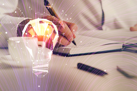 Innovative your business. Idea concept icon on writing mans hand background. Multi exposure.の写真素材