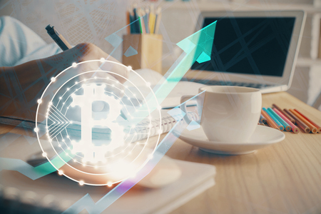 Cryptocurrency hologram, bitcoin, ico theme over hands taking notes background. Concept of blockchain. Multi exposureの写真素材