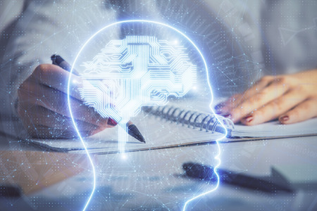 Double exposure of womans writing hand on background with brain hologram. Concept of brainstorming.