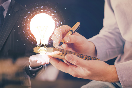 Innovative your business. Idea concept icon on writing mans hand background. Multi exposure.