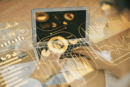 Technology theme hologram with man working on computer on background. High tech concept. Double exposure.の写真素材