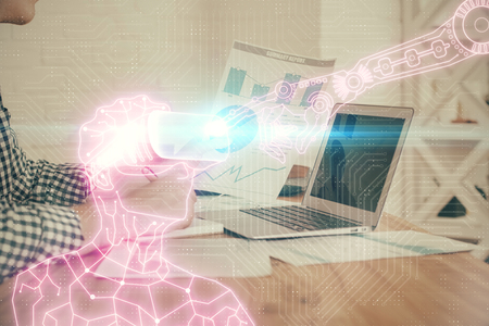 AR hologram with man working on computer on background. Augmented reality concept. Double exposure.の写真素材