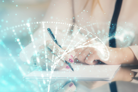 DNA theme hologram over womans hands writing background. Concept of education. Double exposureの写真素材