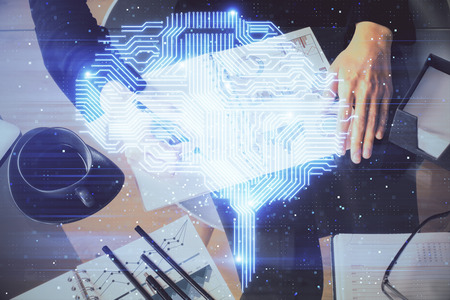 Multi exposure of womans writing hand on background with brain hologram. Concept of brainstorming.