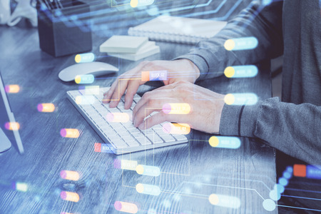 A man working on computer with technology theme drawing. Concept of big data. Multi exposure.の写真素材