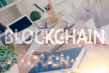 Cryptocurrency hologram over hands taking notes background. Concept of blockchain. Multi exposure