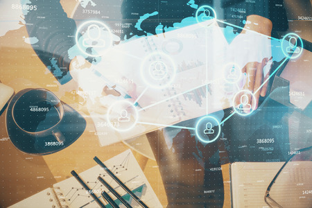 Social network theme hologram over hands taking notes background. Concept of global international...