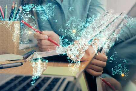 Social network theme hologram over hands taking notes background. Concept of global international people connect. Double exposureの写真素材