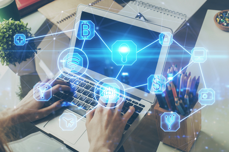 Media network theme hologram with man working on computerの写真素材