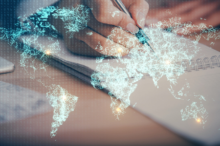 Social network theme hologram over hands taking notesの写真素材