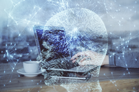 Businessman with computer  with brain theme hologram. Concept of brainstorm. Multi exposure.の写真素材