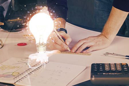 Innovative your business. Idea concept icon on writing mans handの写真素材