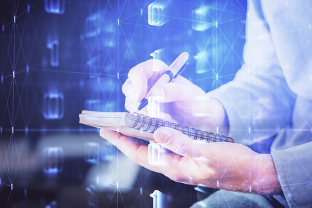 Writing human hands with tech theme multi exposure icons.の写真素材