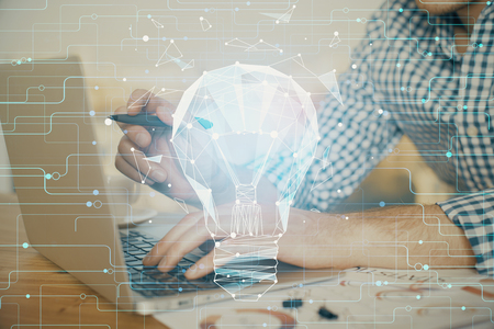 Growing arrows with businessman working on computerの写真素材