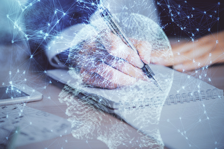 Double exposure of womans writing hand on background with brain hud. Concept of learning.の写真素材