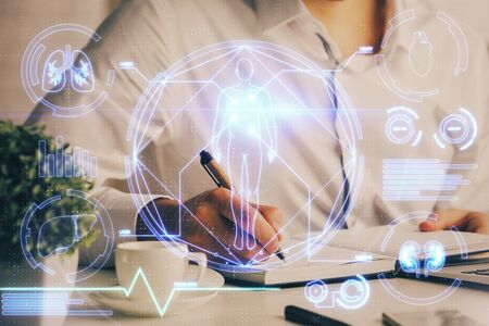 Mans hands working with notes background. Scientist checklist or entry data, research and experiment concept.の写真素材