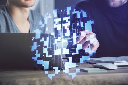 Multi exposure of data internet theme hologram with man working on computer on background. Concept...