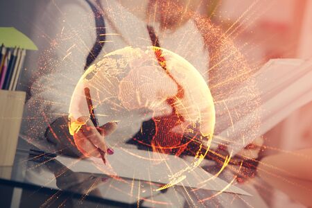 Social network theme hologram over hands taking notes background. Concept of global international people connect. Double exposureの写真素材