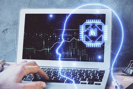 Businessman with computer background with brain theme hologram. Concept of brainstorm. Multi...