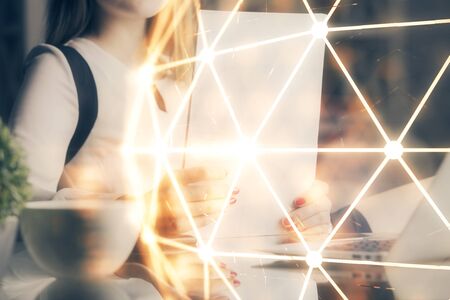 Social network theme hologram over hands taking notes background. Concept of global international people connect. Double exposureの写真素材