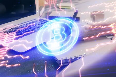 Cryptocurrency hologram over hands taking notes background. Concept of blockchain. Multi exposureの写真素材
