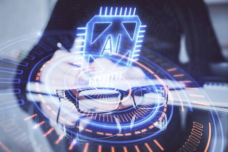 Double exposure of writing hands on background with data solution hologram on front. Technology concept. Side view.の写真素材