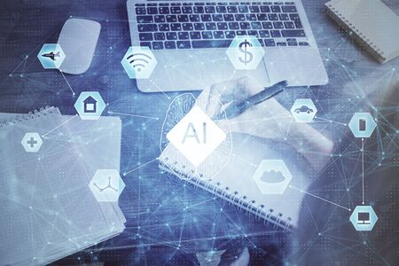 Multi exposure of writing hands on background with data solution hologram. Technology concept.の写真素材