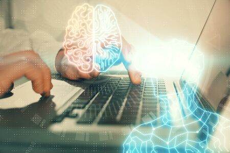 AR hologram with man working on computer on background. Augmented reality concept. Double exposure.