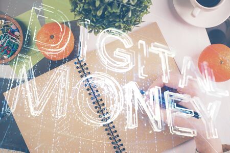 Cryptocurrency hologram over woman's hands writing background. Concept of blockchain. Multi exposureの写真素材