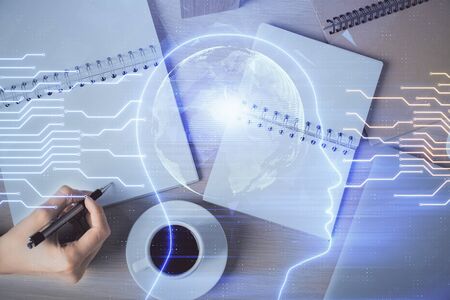 Multi exposure of womans writing hand on background with brain hologram. Concept of brainstorming.