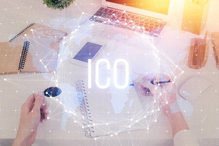 Cryptocurrency hologram over womans hands writing background. Concept of blockchain. Multi exposureの写真素材