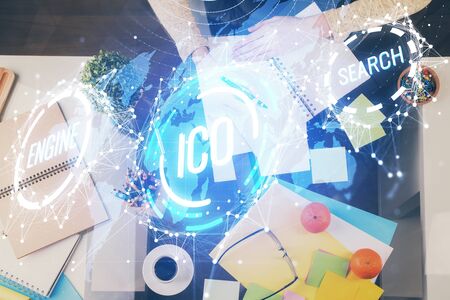 Cryptocurrency hologram over womans hands writing background. Concept of blockchain. Multi exposureの写真素材