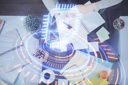 Double exposure of writing hand on background with data solution technology hologram. Ai concept.の写真素材