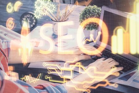Multi exposure of seo icon with man working on computer on background. Concept of search engine...