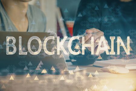 Crypto currency theme hologram with businessman working on computer on background. Concept of...