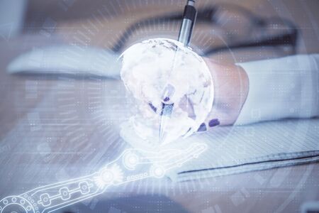 Multi exposure of hands making notes with world map hologram and data theme icons. Concept of global data.の写真素材