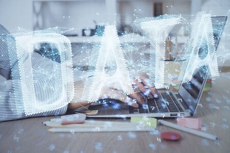 Businessman working on Laptop with technology theme drawing. Concept of big data. Double exposure.の写真素材