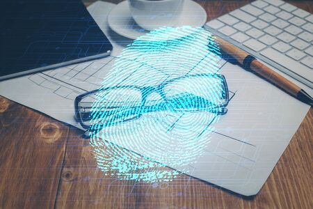 Fingerprint drawing with glasses on the table background. Concept of security. Double exposure.の写真素材