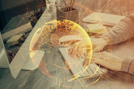 Social network theme hologram with businessman working on computer on background. Concept of world wide web. Multi exposure.の写真素材