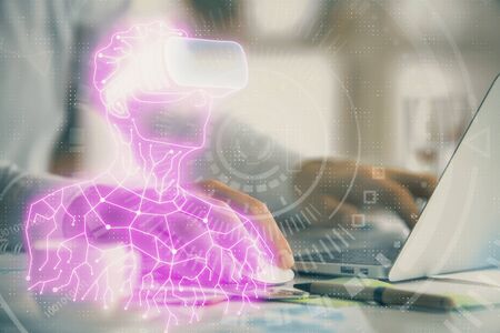AR hologram with man working on computer on background. Augmented reality concept. Double exposure.