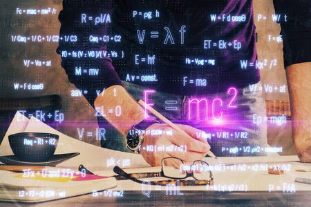 Student or teacher with mathematical and scientific formulas. Concepts of education.