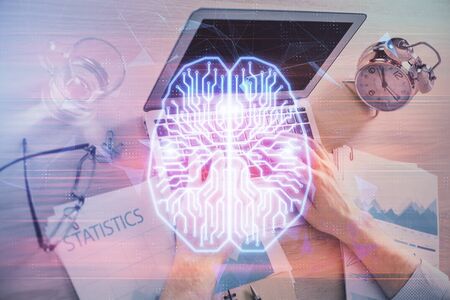 Man typing on keyboard background with brain hologram. Concept of big Data.