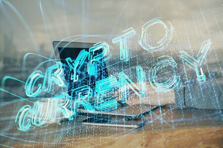 Crypto currency theme hologram with businessman working on computer on background. Concept of blockchain. Double exposure.の写真素材